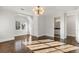 Bright bedroom with hardwood floors, modern lighting, and natural light at 2218 S Clayton St, Denver, CO 80210