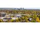 Expansive cityscape view with vibrant fall colors surrounding buildings and highways at 2218 S Clayton St, Denver, CO 80210