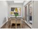 Stylish dining area with modern art, French doors to the patio, and sleek, minimalist design at 2218 S Clayton St, Denver, CO 80210