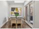 Modern dining room with stylish furnishings and natural light from sliding doors to the backyard at 2218 S Clayton St, Denver, CO 80210