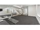 Basement gym featuring glass walls, mirror, and workout area at 2218 S Clayton St, Denver, CO 80210