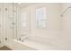 This bathroom has a separate shower and soaking tub at 5668 Galena St, Denver, CO 80238
