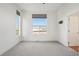 This bedroom has carpet flooring and bright windows at 5668 Galena St, Denver, CO 80238