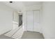 Bright bedroom features closet, white trim and carpeted floors at 5668 Galena St, Denver, CO 80238