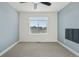 This bedroom features carpet flooring and a bright window at 5668 Galena St, Denver, CO 80238