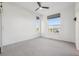 This bedroom has carpet flooring and two bright windows at 5668 Galena St, Denver, CO 80238