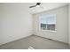 Simple bedroom features a fan, window and carpeted floors at 5668 Galena St, Denver, CO 80238
