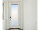 Bright entryway features white door with window panel and white trim at 5668 Galena St, Denver, CO 80238