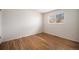 Cozy bedroom featuring hardwood floors, ample natural light, and a simple, clean design at 1529 Ashcroft Dr, Longmont, CO 80501