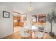 Bright dining area next to the kitchen with sliding doors leading to a deck for indoor-outdoor living at 1529 Ashcroft Dr, Longmont, CO 80501