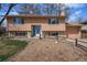 Charming two-story home with a blue door, well-maintained landscaping, and a cozy, inviting appeal at 1529 Ashcroft Dr, Longmont, CO 80501
