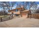 Two-story home featuring a two-car garage, concrete driveway, and fenced backyard at 1529 Ashcroft Dr, Longmont, CO 80501