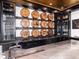 Custom bar area featuring dark wood cabinetry, marble countertops, and decorative whiskey barrel art at 860 Diamond Ridge Cir, Castle Rock, CO 80108