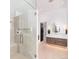Spa-like bathroom with a glass-enclosed shower, double vanity, and access to a walk-in closet at 860 Diamond Ridge Cir, Castle Rock, CO 80108