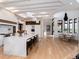Gourmet kitchen with an oversized island, pendant lighting, and a seamless flow into the dining area at 860 Diamond Ridge Cir, Castle Rock, CO 80108