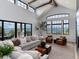 Bright and airy living room with large windows, vaulted ceilings, and comfortable seating at 860 Diamond Ridge Cir, Castle Rock, CO 80108