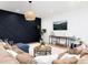 Inviting living room showcasing a plush sectional sofa and elegant decor against a navy accent wall at 860 Diamond Ridge Cir, Castle Rock, CO 80108