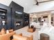 Cozy living room featuring a modern fireplace, custom built-ins, and an open layout perfect for relaxation at 860 Diamond Ridge Cir, Castle Rock, CO 80108