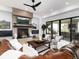 Warm living room with a stone fireplace and a sliding glass door to the outdoor space at 860 Diamond Ridge Cir, Castle Rock, CO 80108