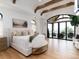 Spacious main bedroom with vaulted ceilings, exposed wood beams, and large windows with seating area at 860 Diamond Ridge Cir, Castle Rock, CO 80108