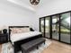 Bright and airy main bedroom with private access to outdoor area through sliding glass doors at 860 Diamond Ridge Cir, Castle Rock, CO 80108