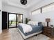 Relaxing main bedroom with natural light, sliding glass door, and decorative black out shades at 860 Diamond Ridge Cir, Castle Rock, CO 80108