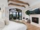 Relaxing main bedroom with a fireplace, balcony access, and nature views at 860 Diamond Ridge Cir, Castle Rock, CO 80108