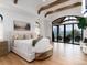 Serene main bedroom with wood beams, balcony access, and scenic views at 860 Diamond Ridge Cir, Castle Rock, CO 80108