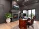 Home office featuring a fireplace, built-in shelving, and an executive desk with scenic views at 860 Diamond Ridge Cir, Castle Rock, CO 80108