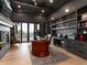 Sophisticated home office features dark walls, built-in shelving, and a wood desk at 860 Diamond Ridge Cir, Castle Rock, CO 80108