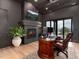 Well-appointed home office with a fireplace, built-in bookshelves, and natural light at 860 Diamond Ridge Cir, Castle Rock, CO 80108
