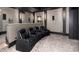 Theater room showing tiered seating and elegant design, perfect for an immersive viewing experience at 860 Diamond Ridge Cir, Castle Rock, CO 80108