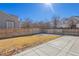 Fenced backyard with grass area and a concrete patio, perfect for outdoor enjoyment at 22134 Wintergreen Way, Parker, CO 80138