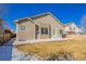 A well maintained backyard featuring a concrete patio, grass, and a wooden fence, perfect for outdoor relaxation at 22134 Wintergreen Way, Parker, CO 80138