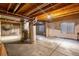 Unfinished basement with concrete floor and exposed ceiling, offering potential for customization at 22134 Wintergreen Way, Parker, CO 80138