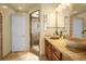 Well-appointed bathroom with tile shower, double sinks, and a neutral color palette at 22134 Wintergreen Way, Parker, CO 80138