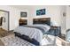 Comfortable bedroom features a bed with storage, neutral walls, and a stylish rug at 22134 Wintergreen Way, Parker, CO 80138