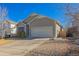 Inviting single-Gathering home with neat landscaping, featuring a two-car garage and a well-kept lawn at 22134 Wintergreen Way, Parker, CO 80138