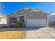 Charming single-Gathering home featuring neutral siding, an attached two-car garage, and a well-maintained front yard at 22134 Wintergreen Way, Parker, CO 80138