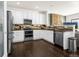 Modern kitchen with stainless steel appliances, sleek countertops, and ample cabinet space for storage at 22134 Wintergreen Way, Parker, CO 80138