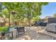 Outdoor patio area with seating, a grill, and a basketball hoop, perfect for entertaining at 9492 Crestmore Way, Highlands Ranch, CO 80126
