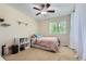Bright bedroom with a large window, showcasing a relaxing retreat filled with natural light at 9492 Crestmore Way, Highlands Ranch, CO 80126