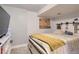 Finished basement bedroom with a large window and sliding barn door at 9492 Crestmore Way, Highlands Ranch, CO 80126