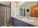 Double vanity bathroom with granite countertops at 10518 Christopher Dr, Conifer, CO 80433