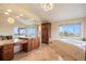 Elegant bathroom with double vanity and soaking tub at 10518 Christopher Dr, Conifer, CO 80433