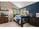 Cozy bedroom with a twin bed and mountain-view window at 10518 Christopher Dr, Conifer, CO 80433