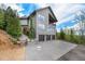 Three-car garage, stone accents, and mountain views at 10518 Christopher Dr, Conifer, CO 80433