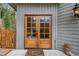 Inviting front entrance with double wood doors and welcome mat at 10518 Christopher Dr, Conifer, CO 80433