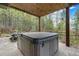 Relax in your private hot tub, nestled on a stone patio with mountain views at 10518 Christopher Dr, Conifer, CO 80433