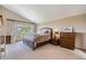 Main bedroom with mountain views and private access to a deck at 10518 Christopher Dr, Conifer, CO 80433